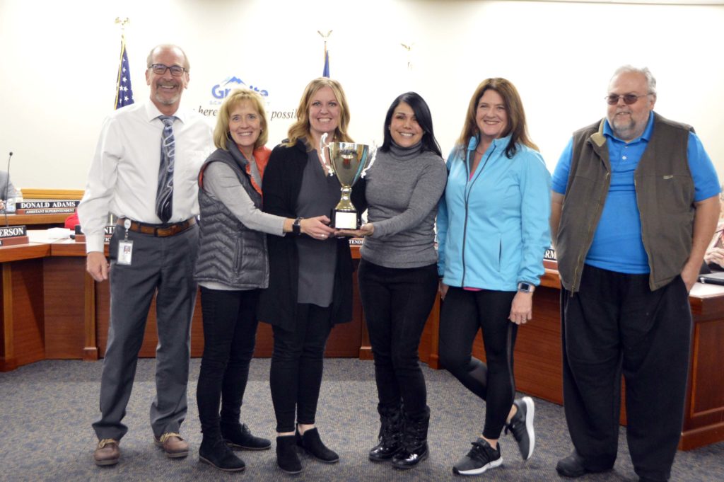 Monroe Elementary teachers holding MGP cup
