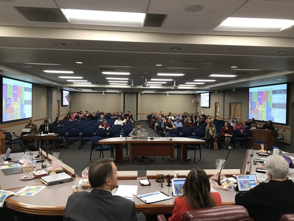 Board members listen to a presentation